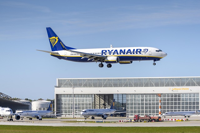 A Ryanair plane above an airport